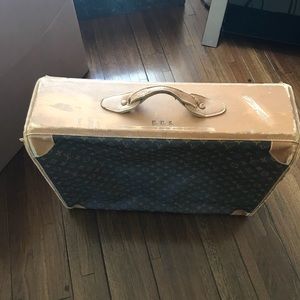 Vintage Louis Vuitton luggage.